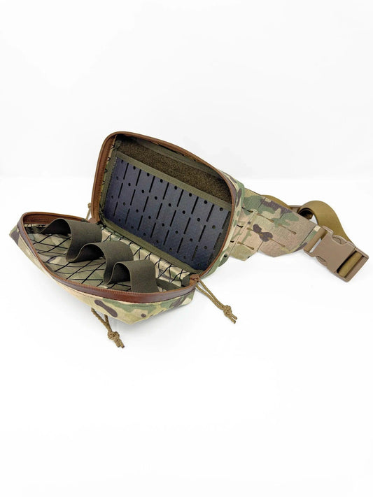 Medical Fanny Pack opened showing the Tegris interior panel with elastic retention loops. Contents sold separately, not included.