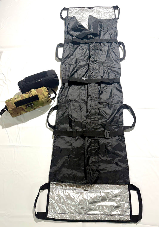 6:8 Medical Solutions Lite Fighter Poleless Litter LFPL-BL — Black ripstop nylon casualty litter, 18 x 72 in deployed with 8 carry handles