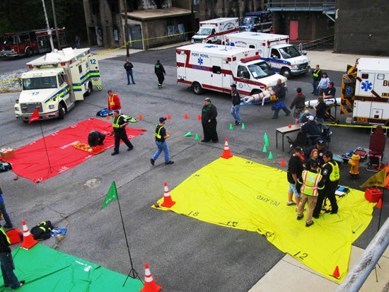 Venue medical personnel and security team staging triage and emergency trauma response